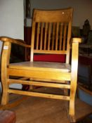 A slat back rocking chair