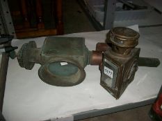 A brass carriage lamp and one other
