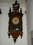 A mahogany wall clock