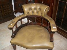 A green leather captain's chair