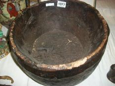 A large heavy wooden bowl