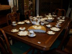 A good quality extending dining table, 2 carvers and 4 chairs