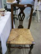 A period oak pad foot chair with rush seat