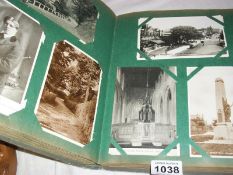 An album containing in excess of 200 old postcards
