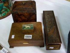A walnut tea caddy, a cigarette box, a stamp box and an a/f carved box