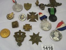 A quantity of medals and badges