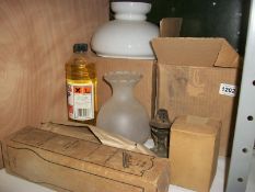 A mixed lot of oil lamp shades, chimneys etc