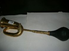 A brass car horn