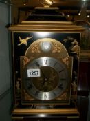 A large lacquered mantel clock