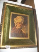 An oil portrait of a man in velvet frame