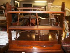 A stained pine wall shelf