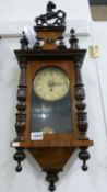 A Victorian mahogany wall clock