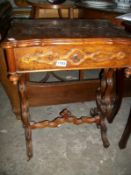 A Victorian walnut veneered work table