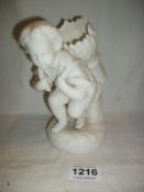 A porcelain cherub spill vase