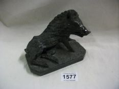 A carved model figure of a boar