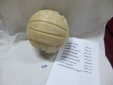 A football bearing the signatures of George Best, Dennis Law, Willie Morgan and 6 others