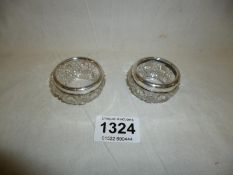 A pair of silver rimmed salts