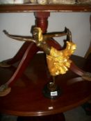 A bronze figure of a dancer.