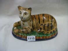 A rare Staffordshire cat on blue/green base