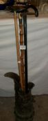 A large pewter jug a/f and 3 walking sticks