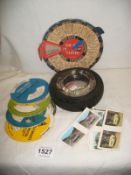 A Goodyear Tyre ashtray and a quantity of vintage car maintenance discs