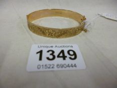 A 9ct gold bangle (20 grammes)