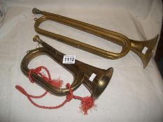 A brass bugle and a brass horn