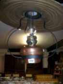 A Victorian hanging oil lamp with copper font