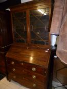 A mahogany bureau bookcase