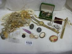 A mixed lot of costume jewellery including 4 silver brooches