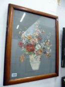 A framed floral arrangement embroidery