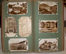 An album containing approximately 250 mainly black and white postcards