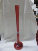 A tall cranberry glass spill vase,  58cm