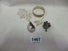 A silver bangle, necklace and 2 brooches