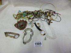 A mixed lot of costume jewellery including wrist watches and silver chain