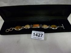 A silver stone set bracelet