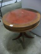 A mahogany drum table