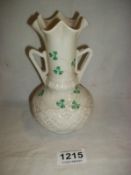 A Belleek vase (Brown mark)