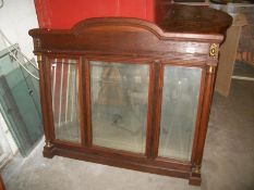 An oak overmantel mirror