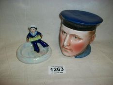 A sailor tobacco jar and a sailor ashtray