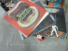 A box of LP records including Rolling Stones