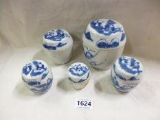 5 blue and white lidded jars
