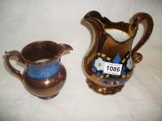 A pair of Victorian lustre jugs
