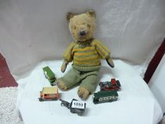 A vintage teddy bear and 5 die cast models