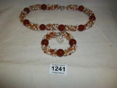 A beaded necklace and bracelet