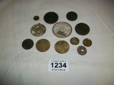 A small quantity of old coins and tokens