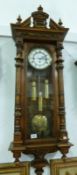 A Victorian mahogany triple weight Vienna wall clock