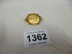 A 1968 gold sovereign in 9ct gold brooch mount