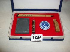 A cased Chinese calligraphy set