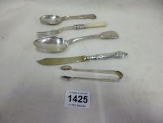 A silver desert spoon, Art Nouveau silver handled knife and 3 other items